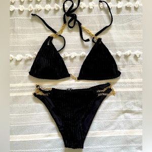 Very cute swimsuit with gold accent